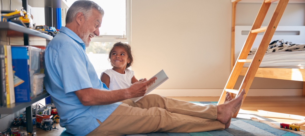 A young family playing in a garden.