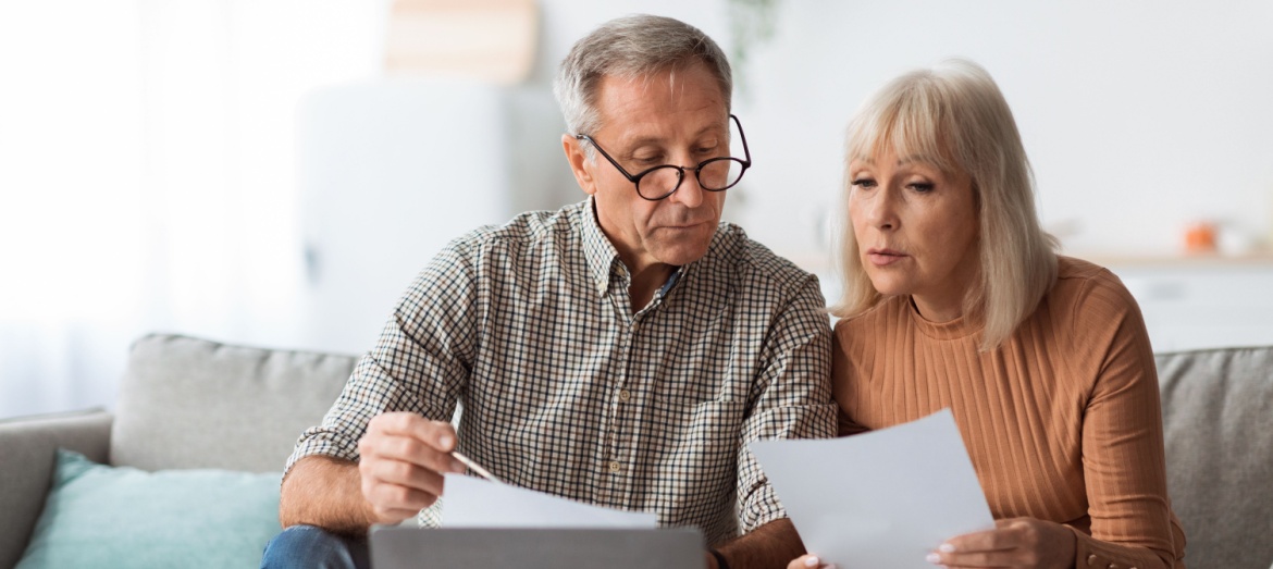 A couple reviewing paperwork together.