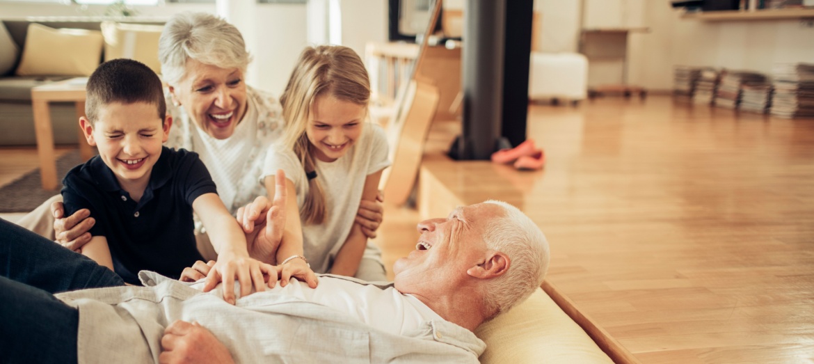 Grandparents playing with their grandchildren.