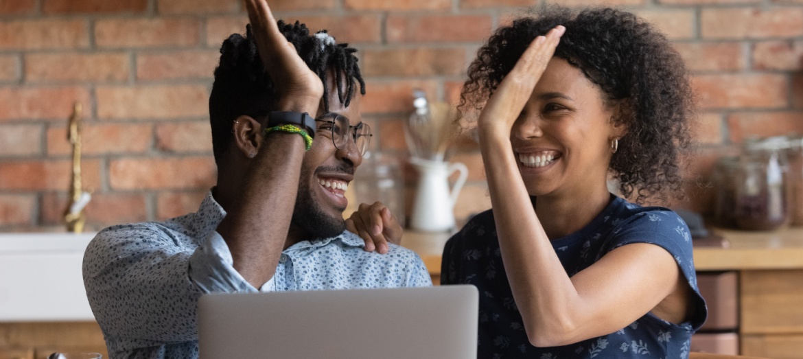 A couple giving a high five.