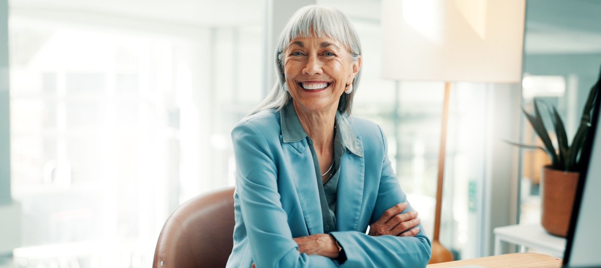 A female business owner sitting at a desk.