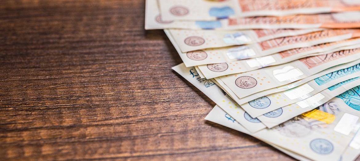 UK bank notes on a table.