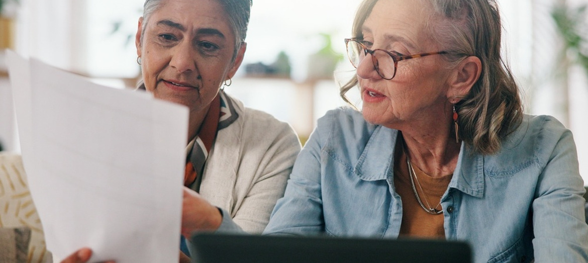 A couple reviewing paperwork together.